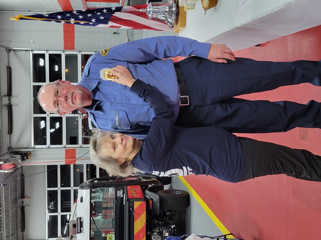 LT. Bensel 's badge pinned on by his wife Kathy.